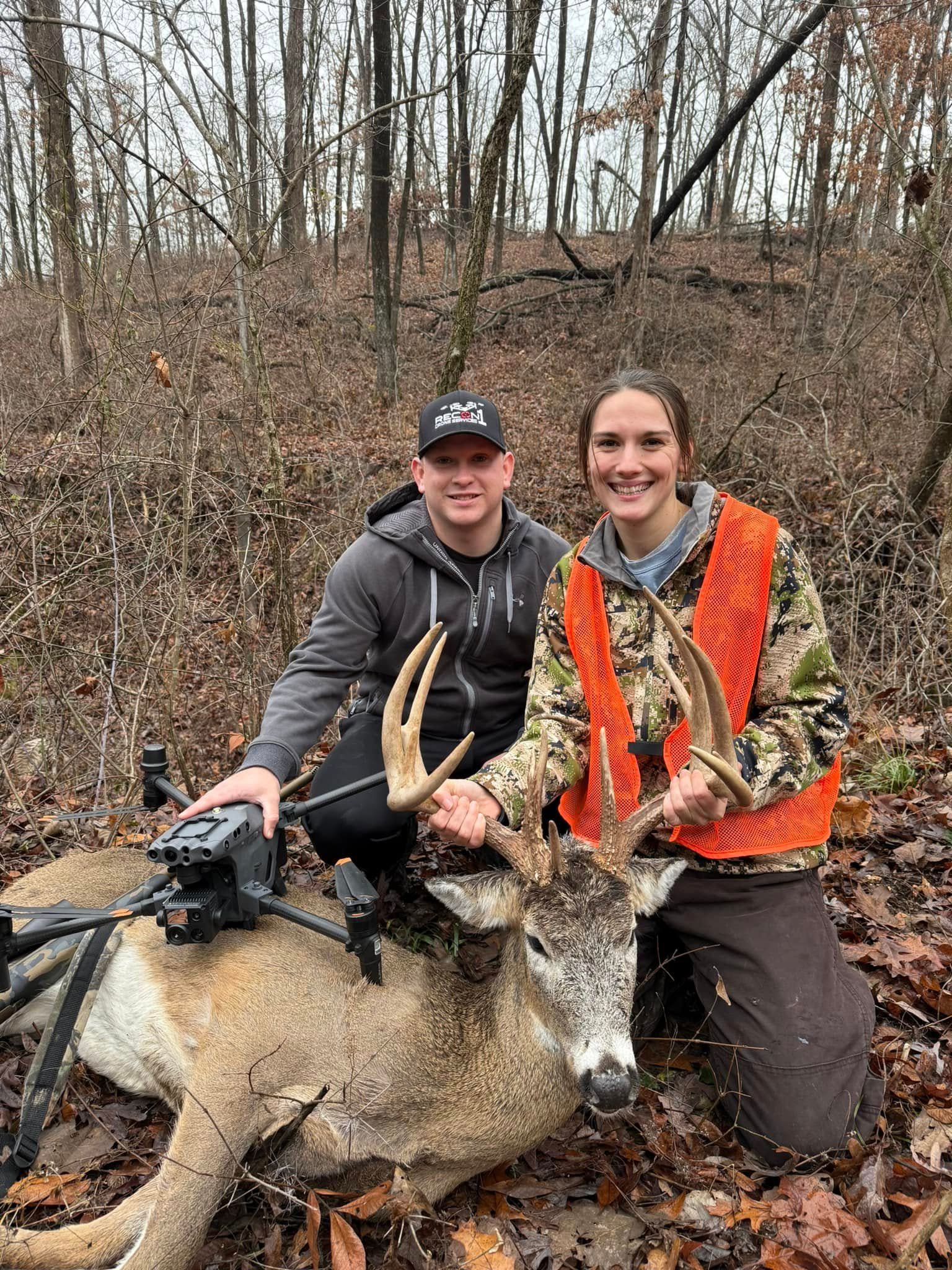 Recon1 clients with a recovered buck and drone, Recon1 hat